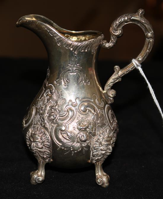 A silver cream jug